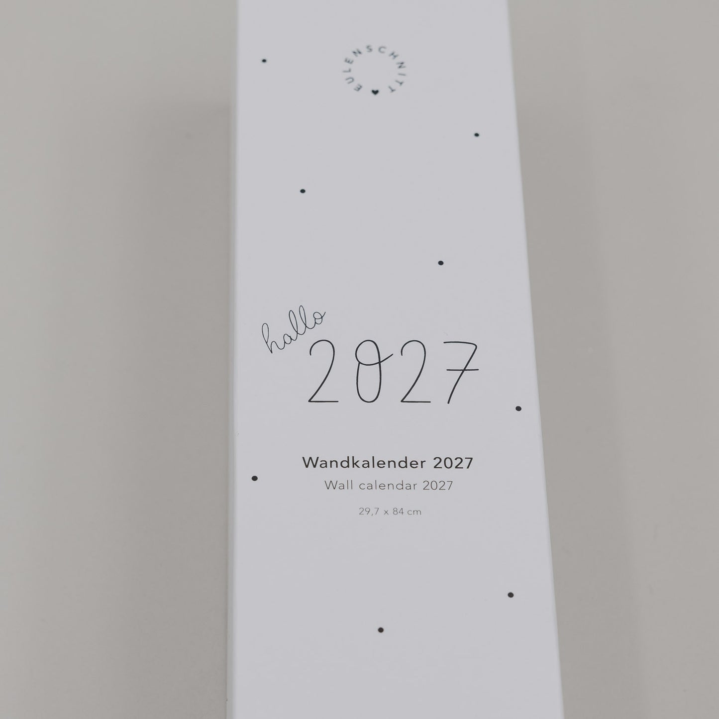Wandkalender 2027 minimalistisch mit „hallo 2027“ Schrift und Punkten