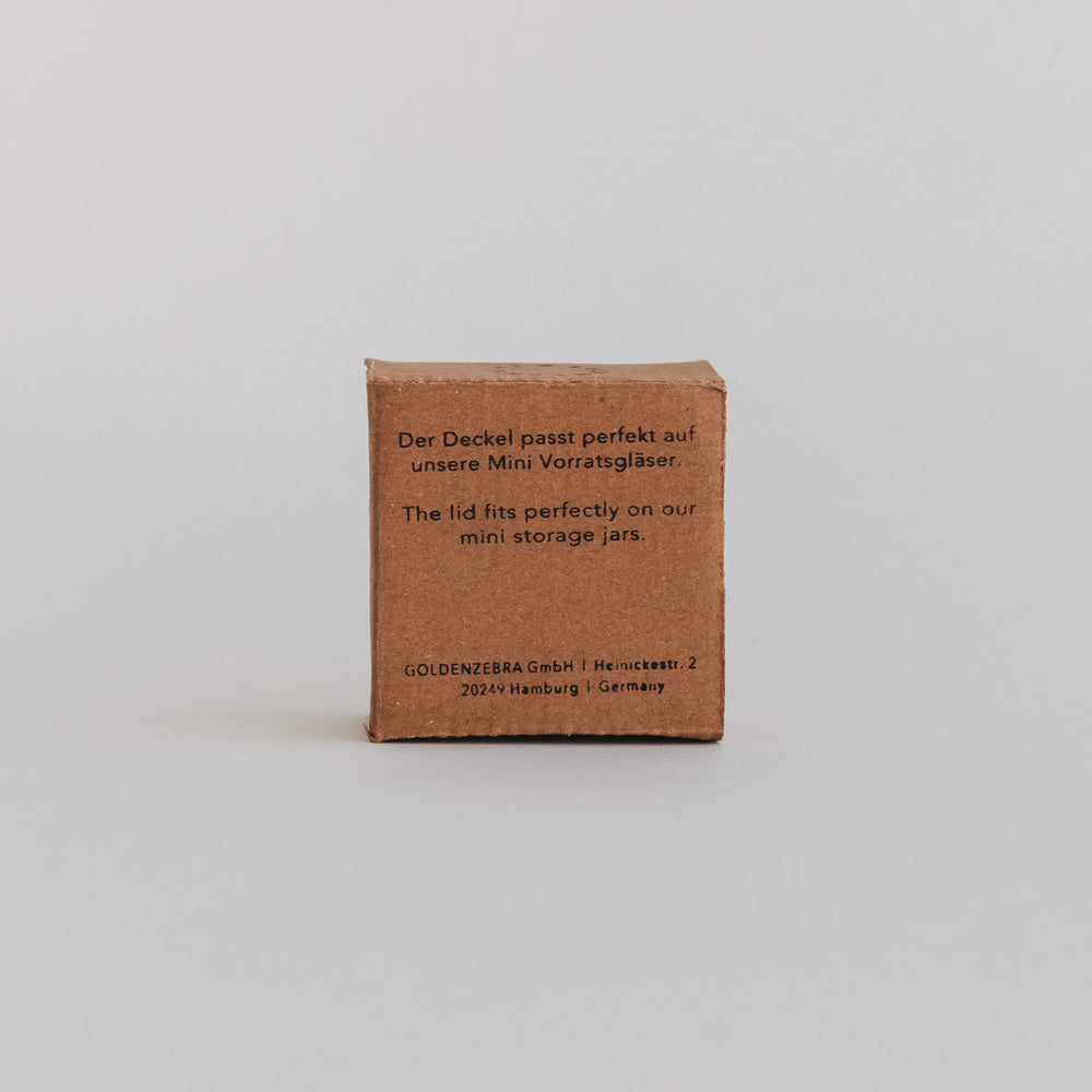 Rückseite der Produktverpackung mit Hinweis: Deckel passend für Mini-Vorratsgläser, Text auf Deutsch und Englisch.