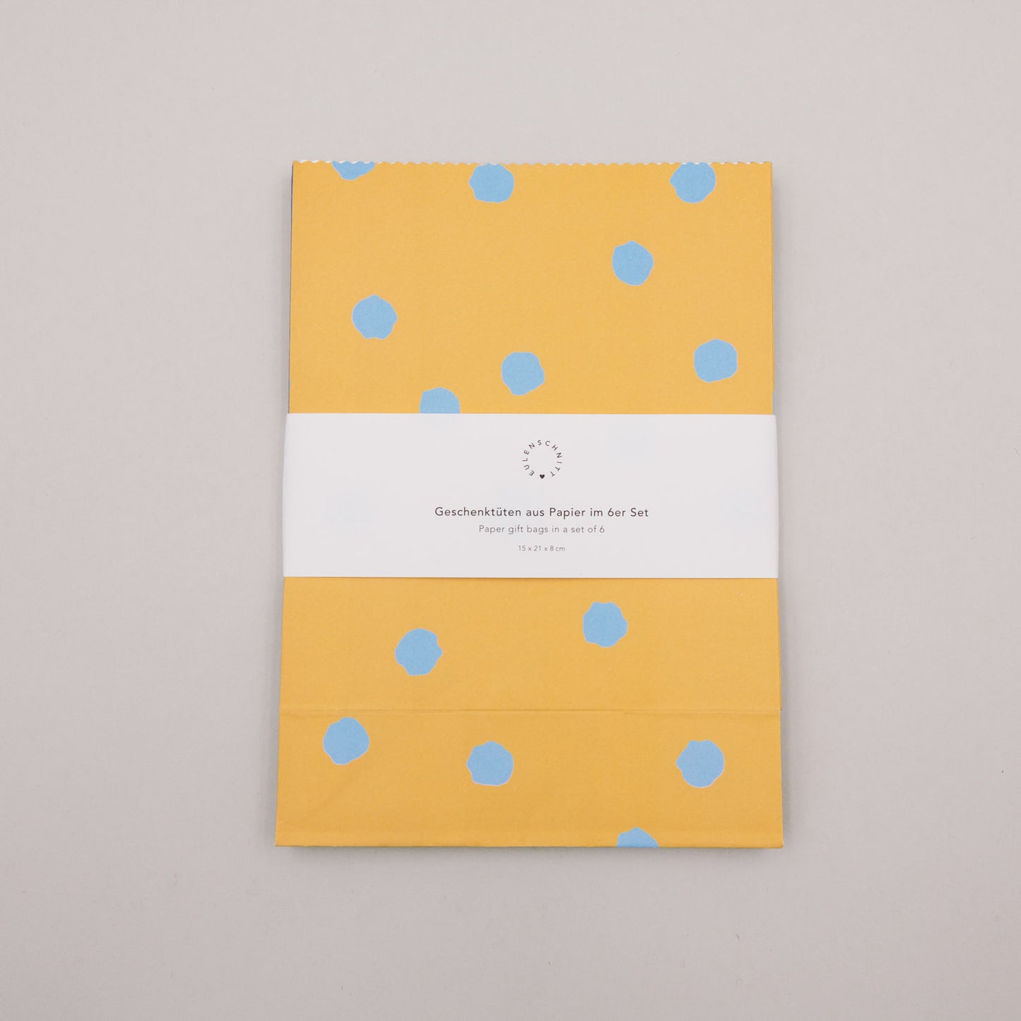 Gefaltetes Papiertüten-Set mit Punkten in Gelb, Teil des 6er Geschenkbeutel-Sets