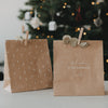 Zwei weihnachtliche Kraftpapier-Geschenktüten mit Tannenmotiven und Spruch „Vorfreude ist die schönste Freude“
